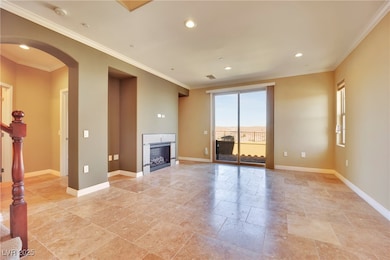 Unfurnished living room featuring a fireplace, sta