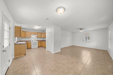 Spacious open-plan area seamlessly blends kitchen,