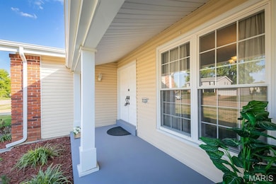 View of exterior entry featuring a porch