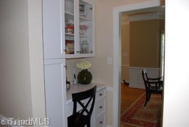 Kitchen. Desk area off of kitchen with builtins.
