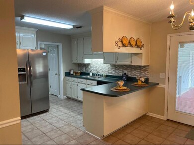 Kitchen with new tile backsplash and stainless app