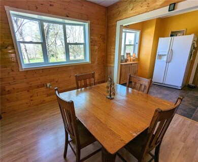 It opens up into the adjoining kitchen.