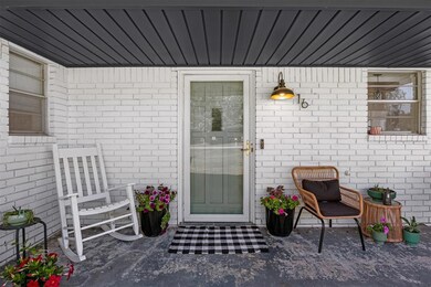 Doorway to property with brick siding
