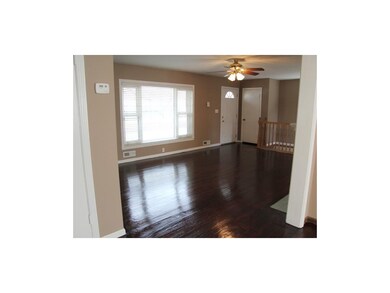 Spacious Living Room.  Gleaming hardwoods.
