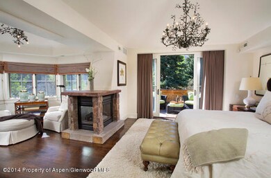 Master Bedroom w/Double-Sided Fireplace