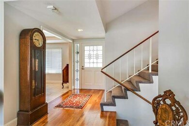 Enter the foyer and view the richly refinished har