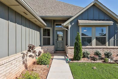 Doorway to property with board and batten siding, 
