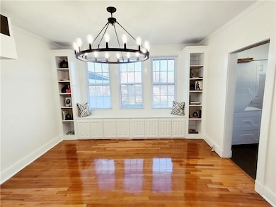 Appreciate the built-in bookcases with seating.