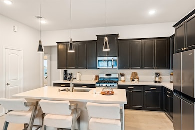 This kitchen offers exceptional storage with an ab