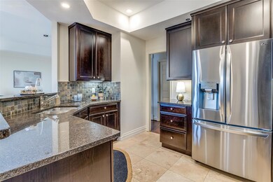 Kitchen featuring stainless steel fridge, tasteful