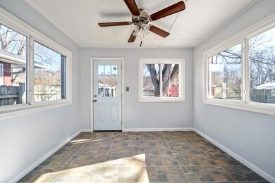 Glass door opens from the kitchen into a pretty su
