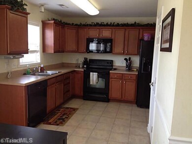 Kitchen. Roomy eat-in kitchen with ample cabinet and counter space.