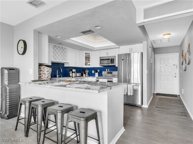 Kitchen featuring stainless steel appliances, whit
