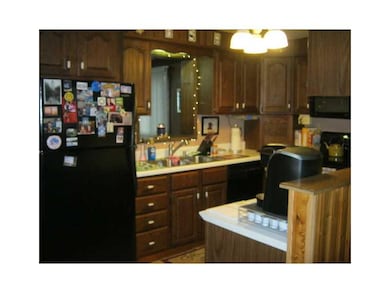 Kitchen. Plenty of cabinets with pass thru to livi
