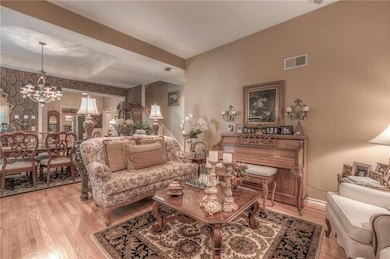 Wonderful open floor plan with gleaming hardwood f