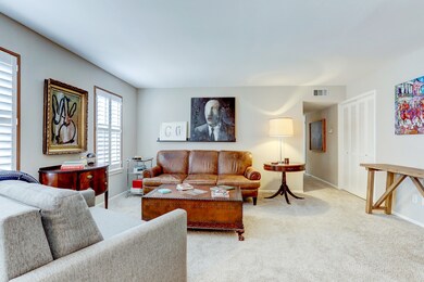 The view of your large living room from the dining