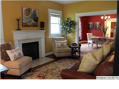 Living room with hardwood floors and fireplace