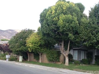 Side view of home with mature trees