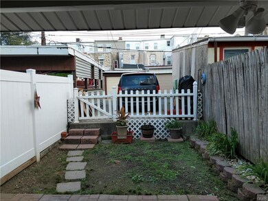 Cozy yard lead to off-street parking pad