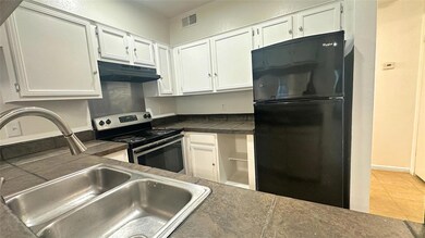 Kitchen featuring visible vents, under cabinet ran