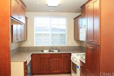 Kitchen with granite countertops and custom cabine
