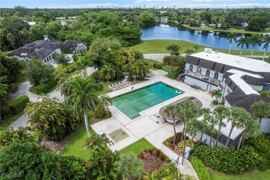 View of urban area with a pool area and a nearby body of water