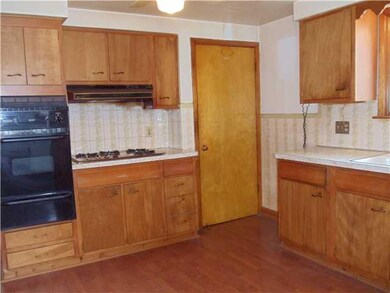 Kitchen. Kitchen features Pergo flooring, built in