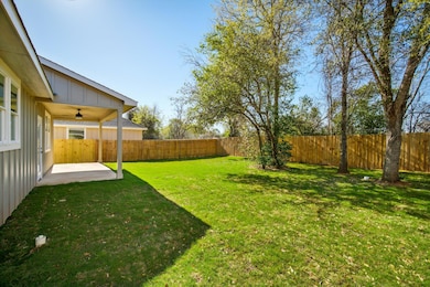 View of yard featuring a fenced backyard, ceiling