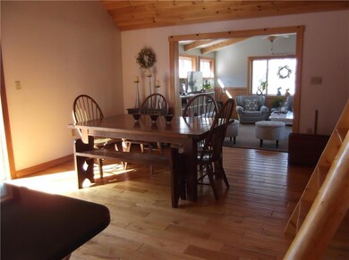 Dining area with wood floor and...