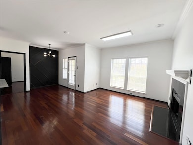 living room featuring wood finished floors, orname