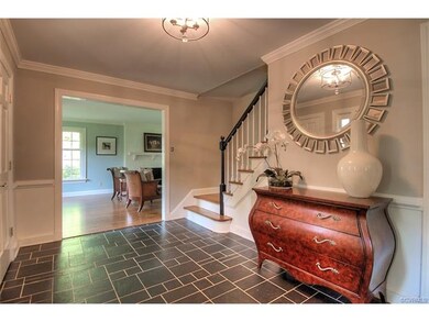 The home greets you with a charming foyer featurin