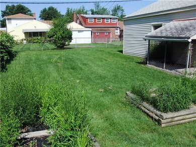Exterior Back. Partially fenced.