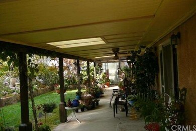 Covered patio on Southern side - green house at fa