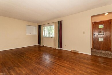 Spare room with dark hardwood flooring