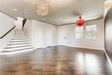 Beautiful staircase with wide open entry into livi