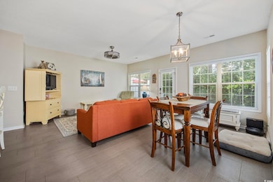 Dining room featuring a chandelier and wood finished floors