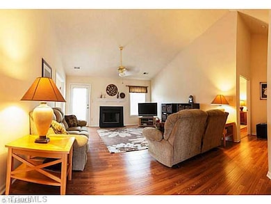 Living Room. Expansive living area with vaulted ceiling and fireplace...perfect for quiet time with a good book or great for entertaining friends and family!