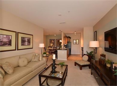 Living room featuring light colored carpet