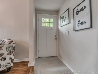 Ceramic tile entry with ambient light from custom