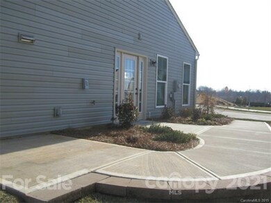 Side of house with entry door into garage