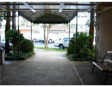 Photo. Covered Area in front of condominium allows