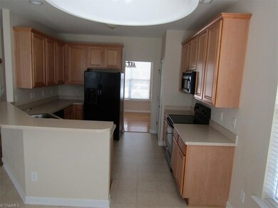 Kitchen from Breakfast Room looking into Dinning Room.