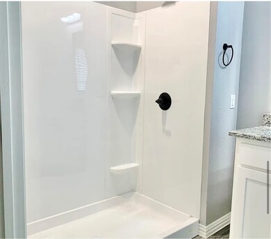 Full bathroom featuring vanity and a walk in shower