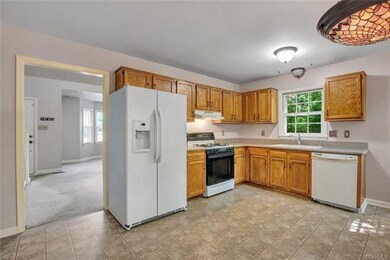 Kitchen with Corian counter tops, gas cooking, pan