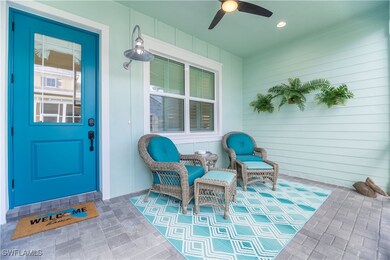 View of exterior entry featuring ceiling fan and a