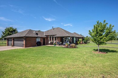 View of front of property featuring brick siding, 3 car attached garage, roof with shingles, and driveway