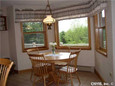 Kitchen. KITCHEN TABLE AREA SURROUNDED BY WINDOWS,