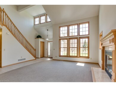 Lovely open, 2 story living room with gas fireplac
