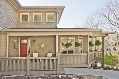 The porch wraps around to the rear of the home.