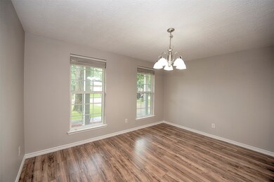 Formal dining room with wonderful space, gorgeous laminate flooring with hardwood appearance and plenty of room for your formal dining table, a china cabinet and even a buffet.